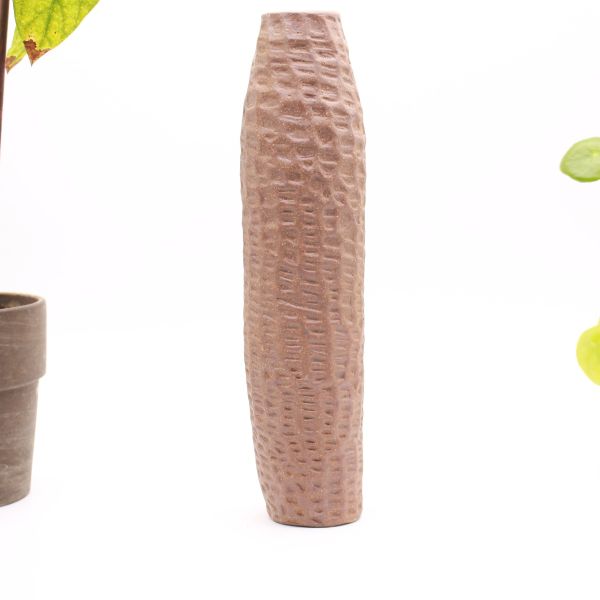 Long thin hand carved vase