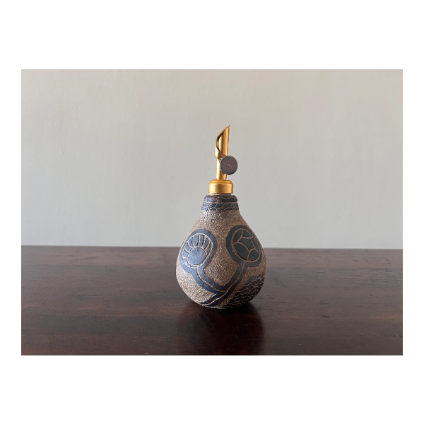 Leaves of Life Tattooed on Clay Oil Bottle