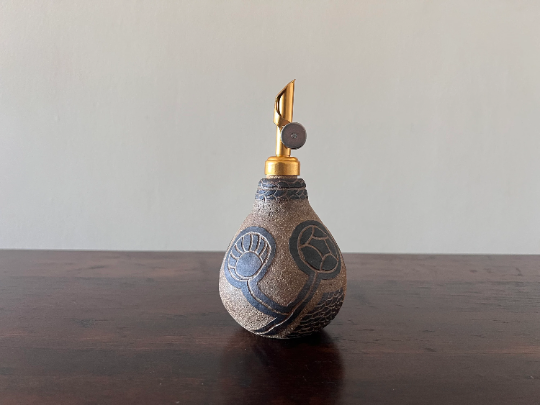 Leaves of Life Tattooed on Clay Oil Bottle